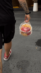 Thai local carries takeout, enjoys cake and fruit