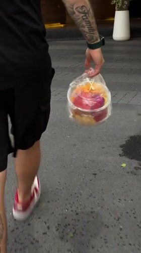 Thai local carries takeout, enjoys cake and fruit