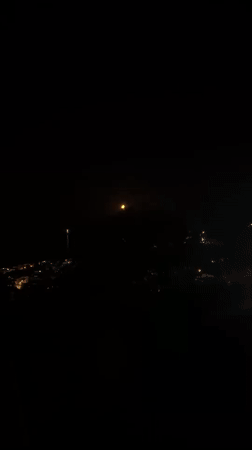 Montenegro residents observe amber moon during late night viewing