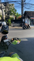Morning motorcycle commute documented in North Kuta, Bali