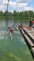 Paddleboarding and canoeing on the Dnipro River on a summer morning