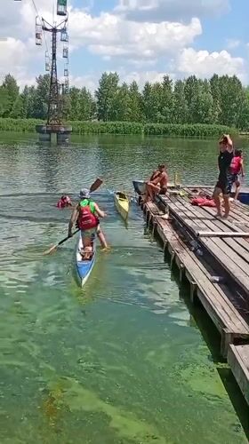 Paddleboarding and canoeing on the Dnipro River on a summer morning