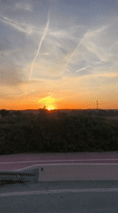 Sunset observed from moving vehicle near Riba-roja de Túria