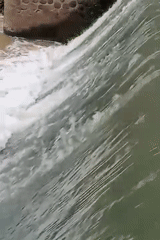 Water flows over small dam in Keudekrueng, Indonesia
