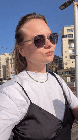 Casual street scenes documented in Bat Yam featuring woman, mirrored sphere