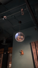 Indoor venue with disco ball documented by witness