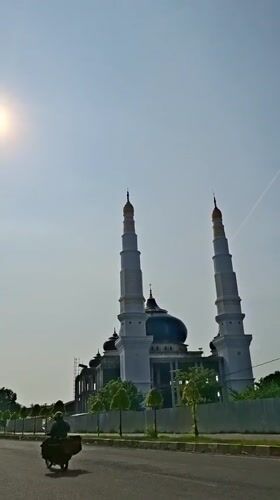 Baiturrahman Grand Mosque documented under clear Indonesian skies