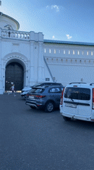 Visitors document New Jerusalem Monastery complex in bright afternoon