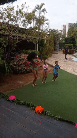 Families enjoy evening recreation at Porlamar resort pools