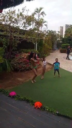 Families enjoy evening recreation at Porlamar resort pools