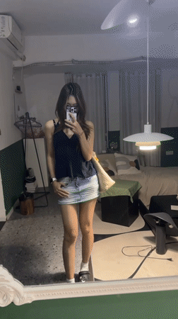 Woman records mirror selfie videos in Liangjiang residence