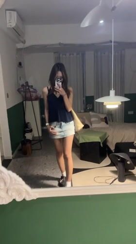 Woman records mirror selfie videos in Liangjiang residence