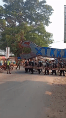 Wrench-shaped float carried through Mataram Baru streets