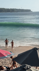 Morning beach activities documented at Amland Beach, Kuta Selatan