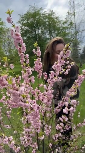 Woman in plaid jacket filmed outdoors in Kryvyi Rih