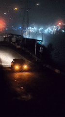 Night traffic and foggy roads in rural Kulang, India