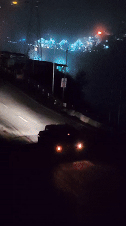 Night traffic and foggy roads in rural Kulang, India