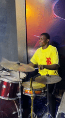 Drummer practices late night in Onitsha music studio