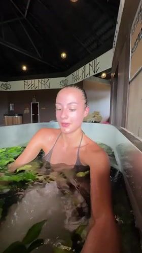 Woman receives ice-water plant therapy at Thai spa