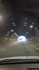 Vehicle crosses tunnel and bridge in Bulgarian mountains
