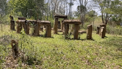 Stone archway structures documented in grassy area near Đà Giang