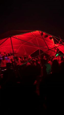 Outdoor party with DJ under geodesic dome in Arambol
