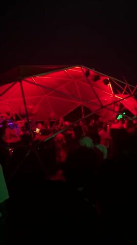 Outdoor party with DJ under geodesic dome in Arambol