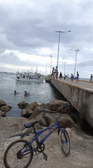 Evening beach gathering documented at Juan Griego pier, Venezuela