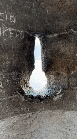 Tourist documents medieval artifacts during Chillon Castle visit