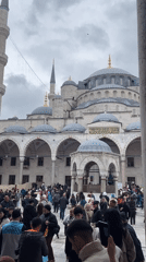 Crowds gather at Istanbul's Blue Mosque on overcast Friday morning