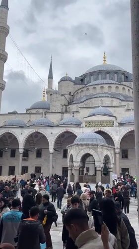 Crowds gather at Istanbul's Blue Mosque on overcast Friday morning