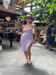 Woman poses for photos at Mengwi restaurant during morning session