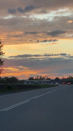 Sunset captured on video along road in Beryozovka, Russia