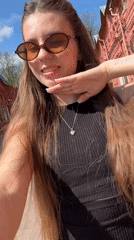 Woman records selfies during morning visit to Klin city square