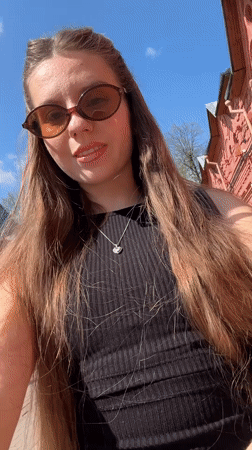 Woman records selfies during morning visit to Klin city square