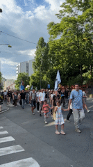 Peaceful march with flags proceeds toward Belgrade Parliament Building
