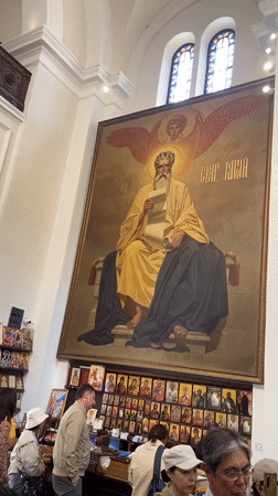 Orthodox clergy conduct digital-assisted service in Kotor church