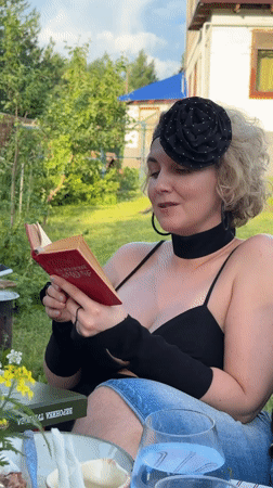Backyard gathering with food and reading in Izhevsk