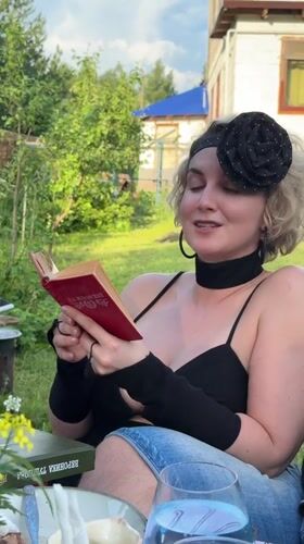 Backyard gathering with food and reading in Izhevsk