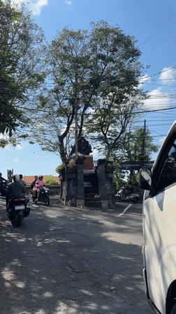 Early morning traffic observed in Denpasar with parked truck