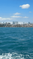 Istanbul waterfront views captured from Bosphorus during sunny afternoon