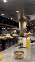 Chef with pink cloth observed in Madrid commercial kitchen
