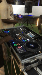 DJ and partygoers captured at indoor social gathering in Kubwa