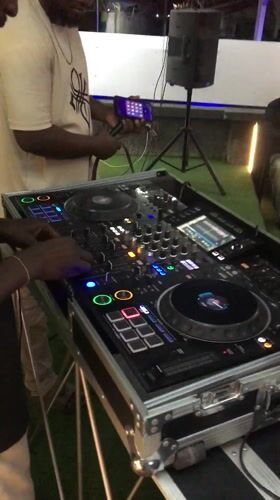 DJ and partygoers captured at indoor social gathering in Kubwa