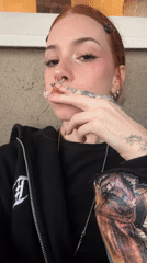 Woman with piercings filmed in Buenos Aires apartment setting