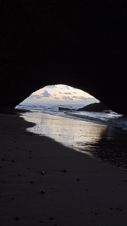Cave View Frames Sandy Beach Scene in Mirleft Morocco