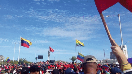 Red-clad crowds rally in Porlamar, Venezuela near Chávez monument