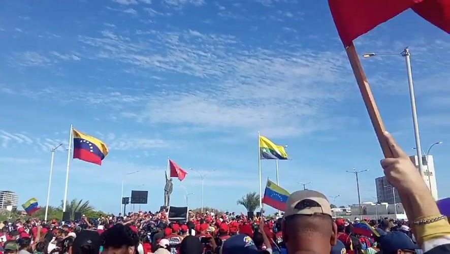 Red-clad crowds rally in Porlamar, Venezuela near Chávez monument
