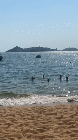 Evening beach vacation scenes documented across Acapulco resort area