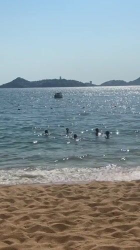 Evening beach vacation scenes documented across Acapulco resort area